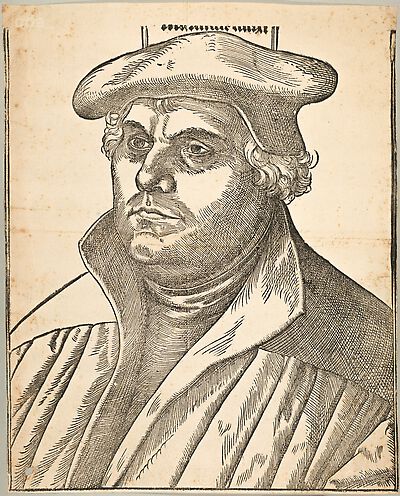 Martin Luther mit Schaube und Barett, Brustbild, nach links, mit Inschrift (beschnitten)