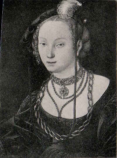 Portrait of a young woman with a feather in her beret